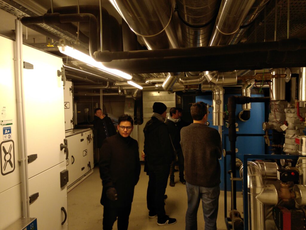 Visit of OEAD passive house standard student dormitory at Seestadt Aspern. Talking a tour in the technical room with the ventilation system Picture by Austrian Institute of Technology GmbH